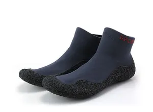 Detail of knit fitness shoe with flexible rubber sole and red SPORT text logo