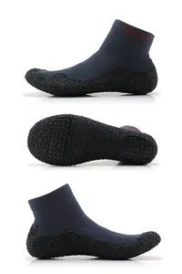 Detail showing non-slip rubber outsole and knit fabric on navy barefoot fitness shoes