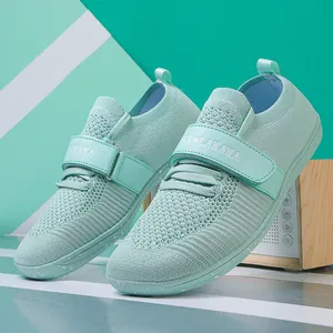 Mint green breathable knit sports shoes with hook and loop strap and speckled sole
