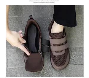 Dettaglio scarpa da camminata marrone con velcro doppio e tomaia in mesh traspirante