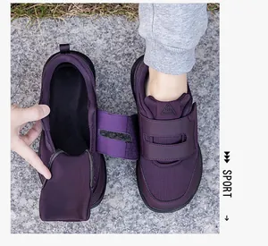 Detail of wide opening velcro sneaker for elderly with purple mesh fabric and easy-wear design