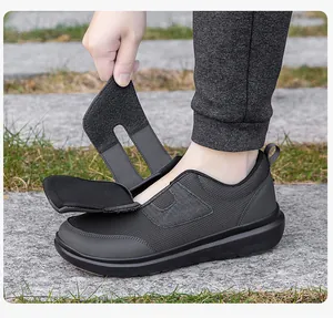 Detail of grey walking shoe with wide velcro straps for elderly comfort and easy access