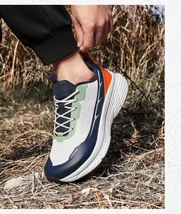 Close-up of wide-toe breathable mesh running shoes for men in a scenic outdoor setting
