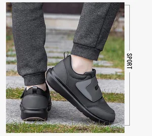 Macro detail of the breathable grey mesh and dual hook-and-loop straps on senior walking shoes