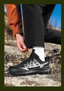 Outdoor hiking shoes with thick shock-absorbing sole and breathable black mesh fabric
