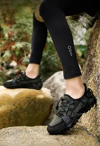Close-up of durable rubber outsole with deep lugs on olive green hiking shoes