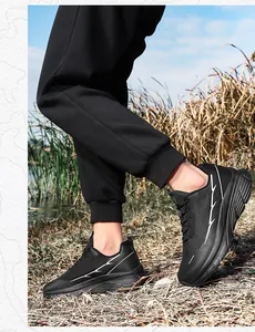 Close-up of black breathable mesh running shoes for men with white side stripe patterns