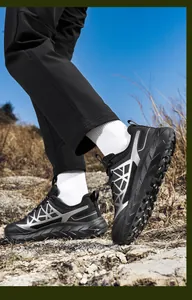 Detail of outdoor trail running shoe with thick non-slip sole and breathable mesh