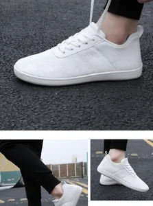 Macro detail of breathable white mesh fabric and laces on these lightweight casual sneakers
