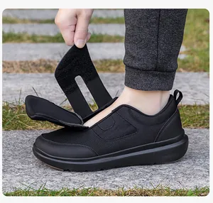 Detail showing adjustable velcro closure on black lightweight mesh walking shoe for seniors