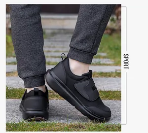 Close-up of black breathable mesh walking shoes with hook and loop closure for elderly