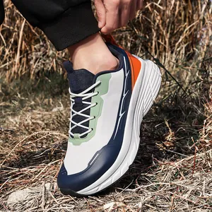Men wide-toe breathable mesh running shoes in navy and white outdoors on grass