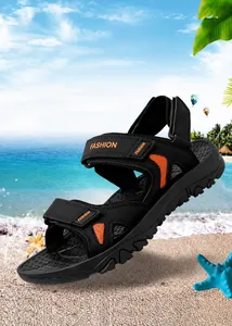 Detail of men's outdoor beach sandal with orange mesh, velcro straps and thick rubber sole