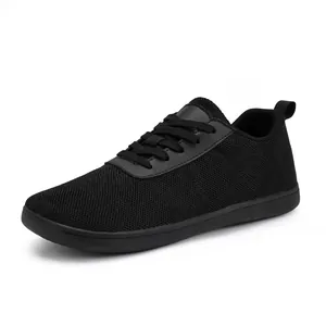 All-black breathable mesh sneakers with non-slip rubber soles for sports and leisure