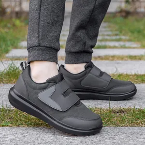 Lightweight charcoal walking shoes with hook-and-loop closure and cushioned sole