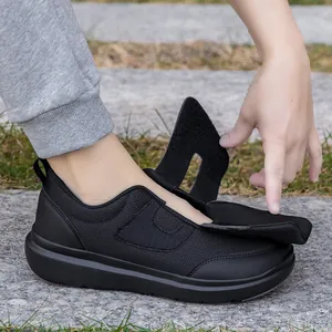 Lightweight black elderly walking shoes with wide velcro straps and breathable mesh