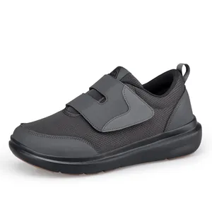 Lightweight grey walking shoes with hook-and-loop straps and cushioned black soles
