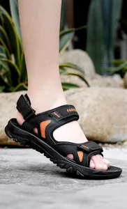 Detail of adjustable velcro straps and breathable mesh on men outdoor sandals