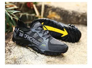 Close-up of breathable mesh hiking shoes with anti-slip rubber soles and quick-lace system