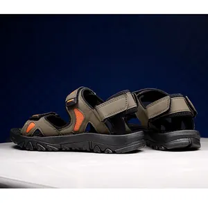 Close-up of olive green men's hiking sandals with thick anti-slip rubber soles and straps