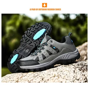 Detailed view of lightweight hiking boots showing non-slip rubber soles and mesh upper