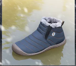 Detail of warm faux fur lining and anti-slip rubber sole on men's winter snow boot