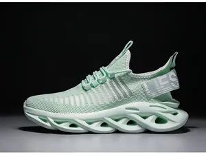 Detailed side view of mint green running shoe with mesh upper and blade cushioning sole