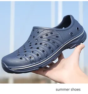 Detail of dark blue EVA summer clogs with breathable holes and anti-slip sole texture