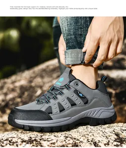 Close-up of premium pigskin outdoor hiking boots on a rocky terrain for hiking