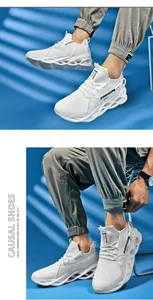 Detail view of white breathable mesh sneakers featuring unique hollow blade sport soles