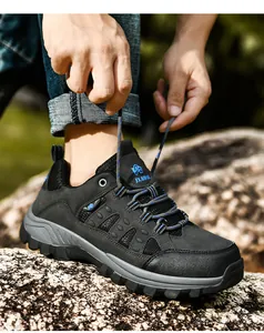 Close-up of lightweight hiking shoes showing textured synthetic leather and mesh details