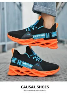 Detail of lightweight sneakers featuring orange hollow cushioning soles and breathable mesh
