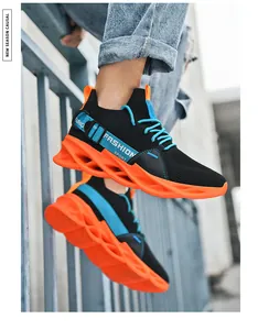 Detail of blade running shoes showing orange hollow shock-absorbing sole and fashion webbing