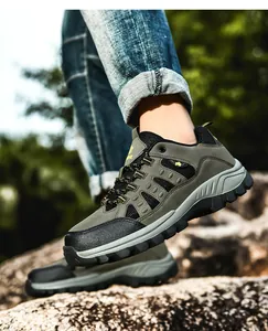 Detail of army green hiking shoes with MD thick rubber sole for outdoor mountain climbing
