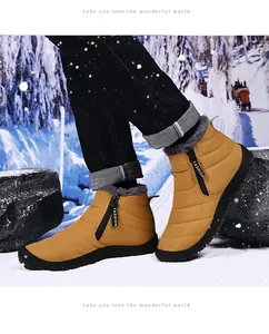 Detail of waterproof ginger snow boot with warm fur lining and stylish black side zipper