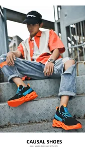 Detailed view of lightweight blade running shoes with orange hollow out soles on stairs