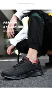 Vista lateral de zapatillas deportivas negras para hombre con motivos plateados y forro rojo
