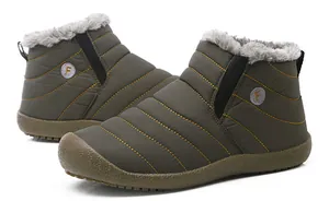 Detailed view of olive green waterproof snow boots with quilted stitching and thick fur lining