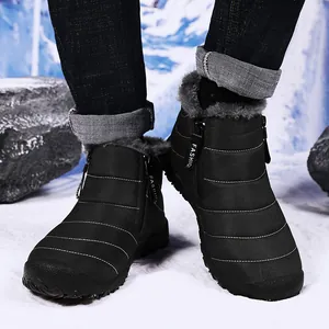 Detailed view of black waterproof snow boots with warm faux fur lining and side zippers
