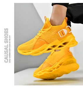 Detail view of bright yellow breathable mesh sports shoe with hollow blade sole on foot