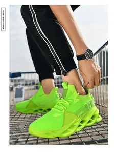 Detail of neon green breathable mesh upper and wavy hollow sole sneakers on a metal cart