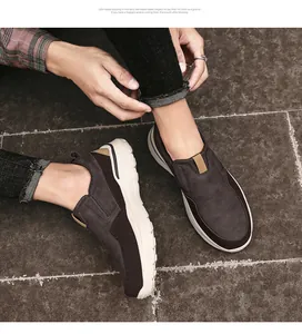 Macro detail of men's slip-on loafers featuring suede texture and flexible rubber soles