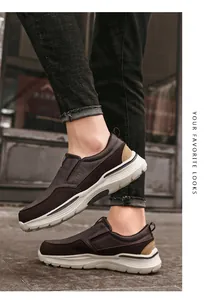 Close-up of brown casual slip-on shoes with thick white soles and classic side branding