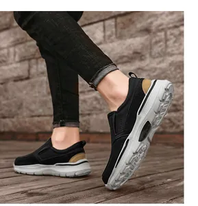 Dynamic close-up of men's black slip-on shoes featuring a thick white anti-slip sole