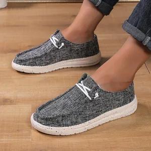 Men's grey canvas loafers featuring unique black splatter texture on thick off-white soles