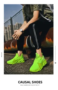 Detailed view of neon green breathable knitted casual sneakers with structural blade sole