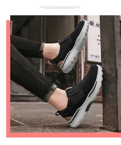 Detail of slip-on men casual shoe featuring classic logo and thick grey cushioned sole