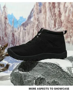 Close-up of black waterproof snow boots with thick faux fur lining and anti-slip rubber sole