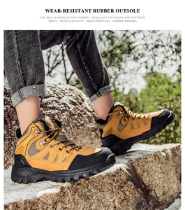 Detail of high-top hiking boots with soft rubber sole on rugged terrain