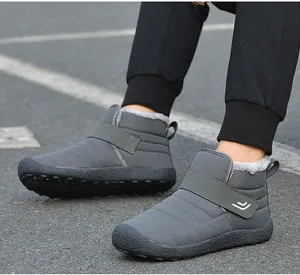 Detail of dark grey snow boot with quilted waterproof fabric and plush lining